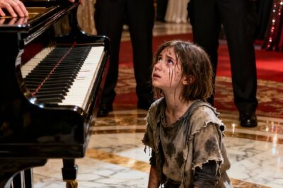 The guest of honor, legendary pianist Lawrence Carter, stepped forward, brushed the guards aside, and said: “Let her play. An opportunity for youth, right? Let’s hear it.”