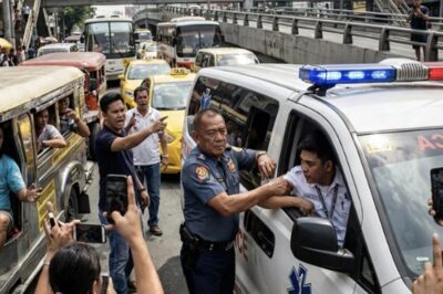 A TRAFFIC ENFORCER STOPPED AN AMBULANCE WITH A PATIENT ON BOARD, SO PEOPLE GET ANGRY AND VIDEO HIM, BUT THEY STOPPED WHEN HE SUDDENLY PULLS THE DRIVER OUT AND HE TAKES THE DRIVE.