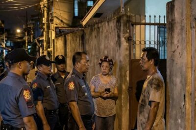 A GOSSIP NEIGHBOR WHO DID NOTHING BUT WATCHED EVERY MOVEMENT OF THE PEOPLE AROUND HIM AND SUSPECTED THAT THE NEWLY MOVED FAMILY WAS DOING SOMETHING EVIL BECAUSE OF THE NOISES EVERY NIGHT